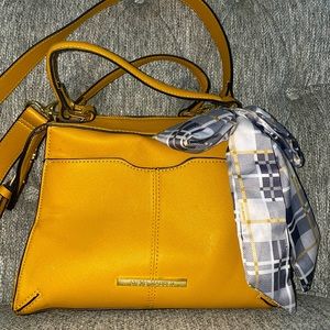 Steve Madden yellow purse with gray and yellow checkered bow tie.